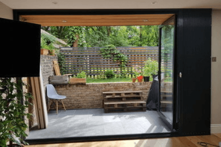Collapsible security bars for sliding doors